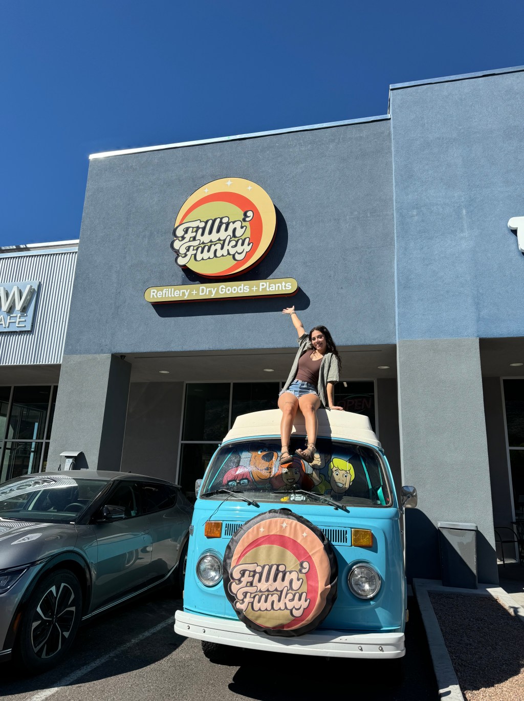 Gabi on her VW van in front of Fillin' Funky